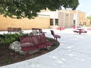 small red benches