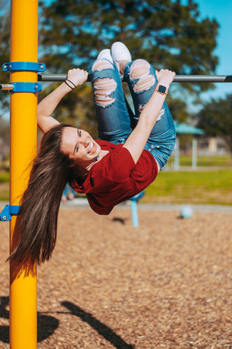 girl on playground equipment