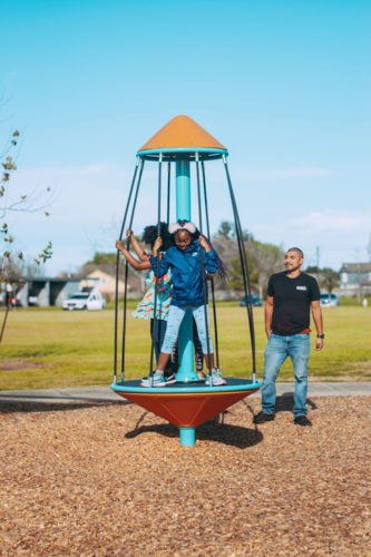girls on rocket play equipment