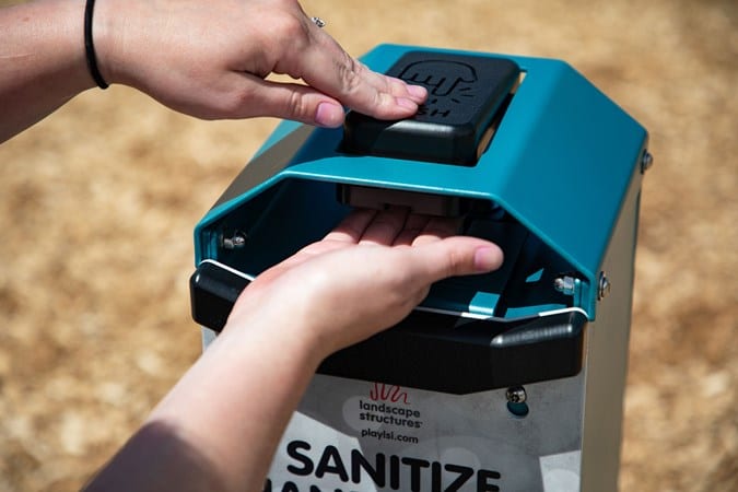 hand sanitizer station being used