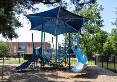 beach inspired compact play ground with built in shade